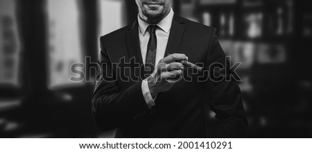 Image of an adult stylish man in a suit with a cigar. Cigar clubs concept. Mixed media Royalty-Free Stock Photo #2001410291