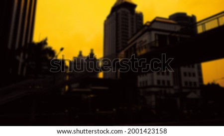 Landscape silhouette of city buildings, with sunset rays.isolated concept blur background.