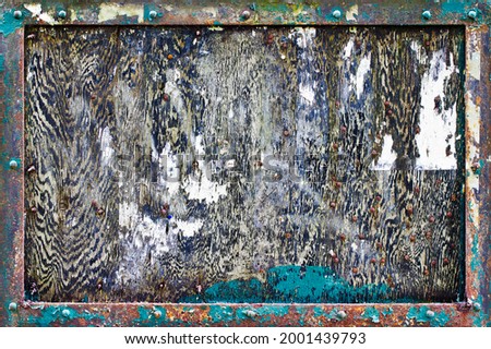 A heavily weathered and textured noticeboard Royalty-Free Stock Photo #2001439793