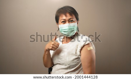 Happy senior woman after receive vaccine dose, Ideas for senior citizen getting fully vaccinated, No side effects from covid vaccine, Encourage Older Adults to getting vaccine, Vaccination at home Royalty-Free Stock Photo #2001444128