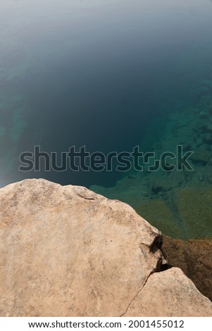 Quiet river stream along the tectonic rocks
