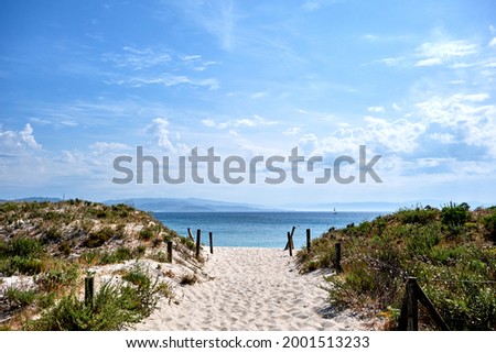 Sand beach dunes in Cies Islands nature reserve, white sand and clear turquoise water.  Atlantic Islands of Galicia National Park, Spain. Royalty-Free Stock Photo #2001513233