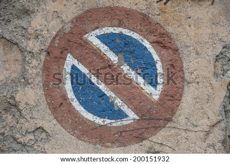 No parking sign painted in a wall