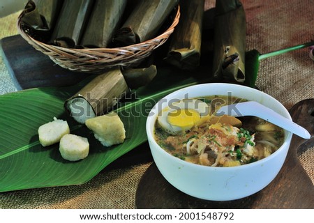 Soto is a typical Indonesian food such as soup made from meat and vegetable broth. Soto is usually served with rice, rice cake, ketupat, noodles, or vermicelli Royalty-Free Stock Photo #2001548792