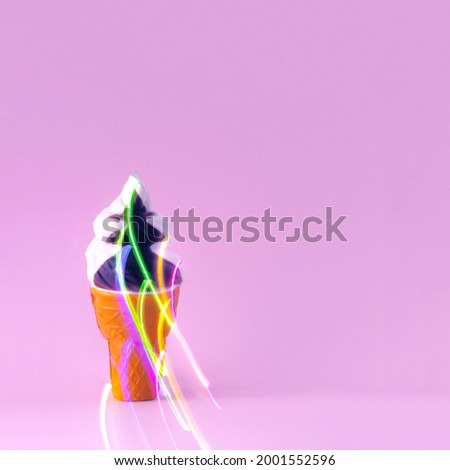 Ice cream in a cone with lantern light. Summer party. Minimal composition on pink backgrounds.
