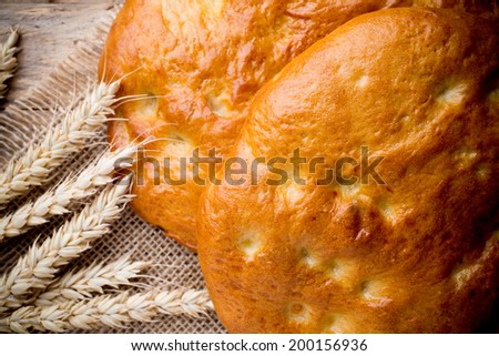Fresh Turkish bread on a wooden background. Studio photography.