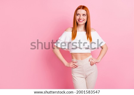 Photo of cheerful young happy woman dream look empty space smile isolated on pastel pink color background