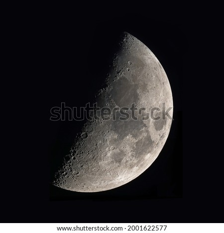 First quarter moon a seen through telescope.