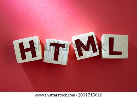 html inscription on wooden cubes on a red background
