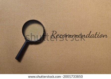 Top view image of magnifying glass with Recommendation wording