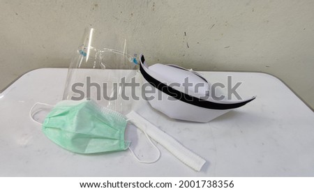 Background image showing covid-19 PPE. for nurses in Thailand.