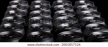 Focus on the front. Close-up aluminum drink can on the background, side view. Beer can or soft drink. Contrast lighting - exposure.
