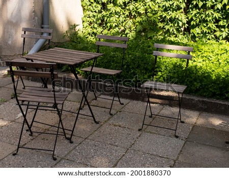 Tables in street cafes of the city. Royalty-Free Stock Photo #2001880370