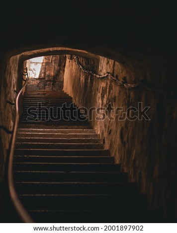 Stairs up out of the tunnel where the golden sun shines. Dramatic feeling. Hiiumaa, Estonia