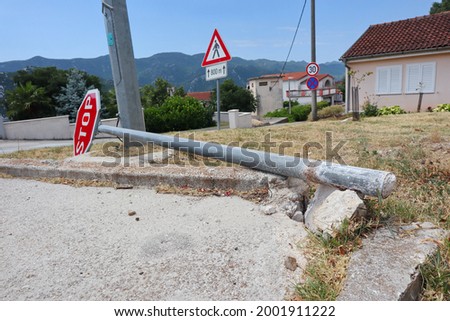 Demolished traffic sign stop on the ground