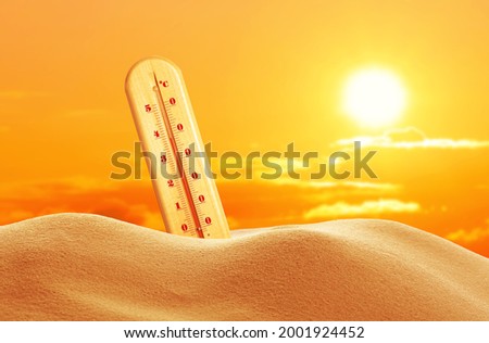 Weather thermometer with high temperature outdoors on hot sunny day. Heat stroke warning Royalty-Free Stock Photo #2001924452