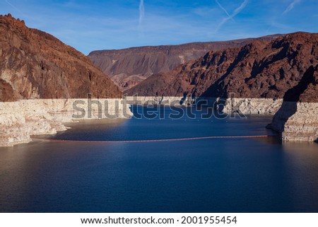 A prolonged drought in the West, the reservoir created by the Hoover Dam, pictured here in 2010, sunk to its lowest level ever raising concerns about reduced output from the dam’s hydroelectric plan. 