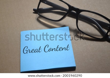 Top view image of eyeglasses with Great Content wording. Business concept