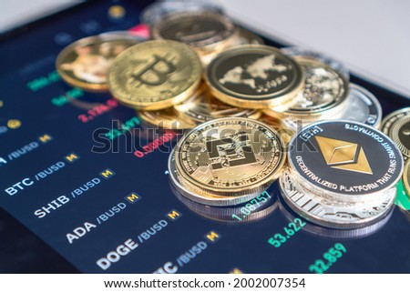 Cryptocurrency on Binance trading app, Bitcoin BTC with BNB, Ethereum, Dogecoin, Cardano, Litecoin, altcoin digital coin crypto currency defi p2p decentralized finance and fintech banking market Royalty-Free Stock Photo #2002007354