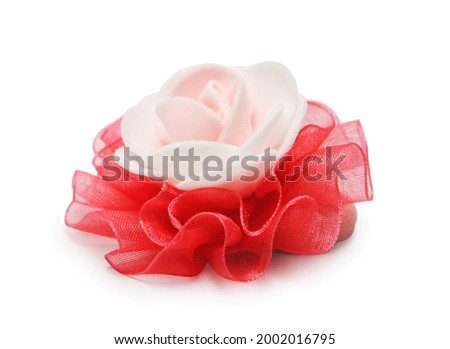 Hair tie in the form of a rose isolated on white background