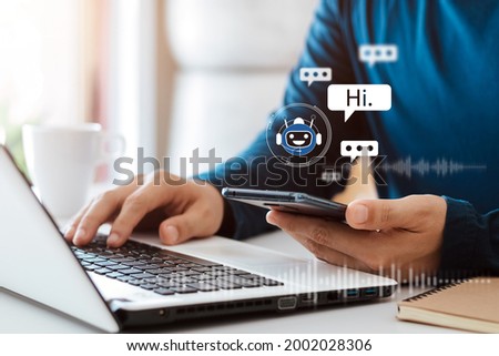 AI Chatbot intelligent digital customer service application concept, computer mobile application uses artificial intelligence chatbots automatically respond online messages to help customers instantly Royalty-Free Stock Photo #2002028306