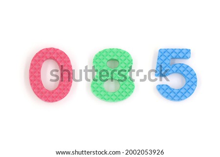 number 085 isolated on white background. Colorful letters on background close up. Alphabet toy. Number eighty five.