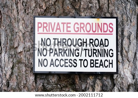 No parking private grounds sign outside house