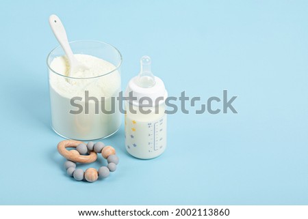 Preparation of formula for baby feeding. Baby health care, organic mixture of dry milk concept. Royalty-Free Stock Photo #2002113860