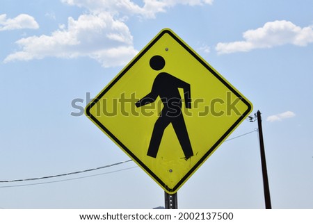 A pedestrian symbol marks where people walk.