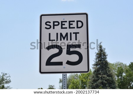 Speed Limit 25 sign in rural America.