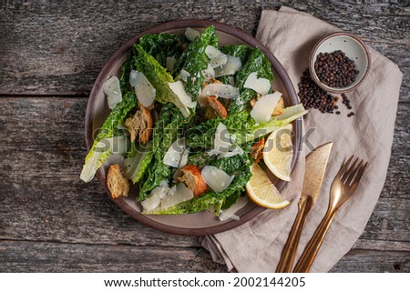 Caesar Salad with Homemade Croutons and Shaved Parm Royalty-Free Stock Photo #2002144205