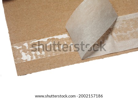 Sticky area for resealing a cardboard package, close up Royalty-Free Stock Photo #2002157186