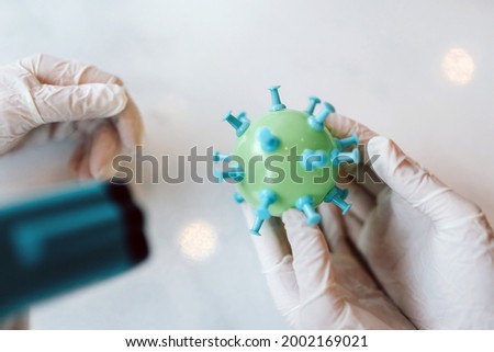 Scientist virologist holding model of new Coronavirus or COVID-19