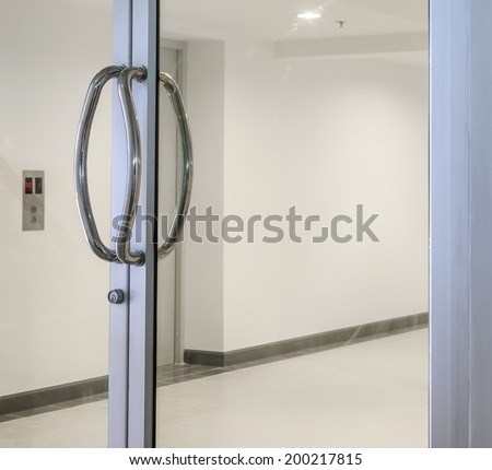 Glass door with chrome handles Royalty-Free Stock Photo #200217815