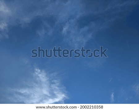 Vast blue sky with light cloud