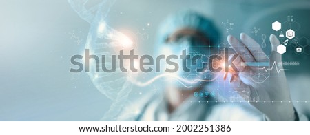Abstract luminous DNA molecule. Hand of doctor touching and cut dna for checking with analysis chromosome DNA genetic of human on virtual interface. Medicine, Medical science and biotechnology. Royalty-Free Stock Photo #2002251386