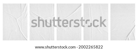 white paper wrinkled poster template ,blank glued creased paper sheet mockup.white poster mockup on wall. empty paper mockup. Royalty-Free Stock Photo #2002265822