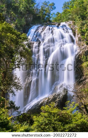 Khlong Lan Waterfall, large and exotic waterfall in tropical forest in National Park, Kamphaeng Phet, Thailand