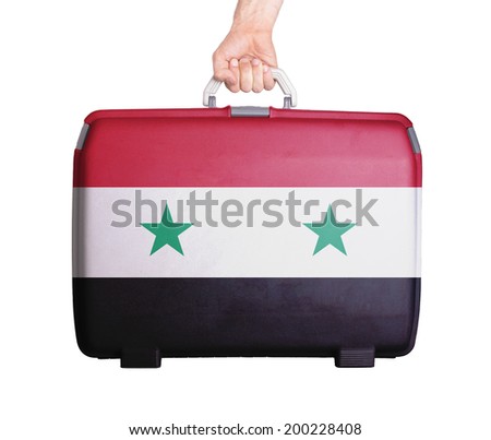 Used plastic suitcase with stains and scratches, printed with flag, Syria