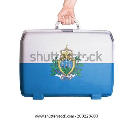 Used plastic suitcase with stains and scratches, printed with flag, San Marino