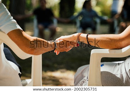Close up couple holding hands, sharing circles psychology 