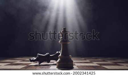White king checkmates the black king, chess game and competition concept Royalty-Free Stock Photo #2002341425