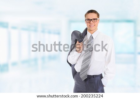 Portrait of young happy smiling business man, isolated over white background