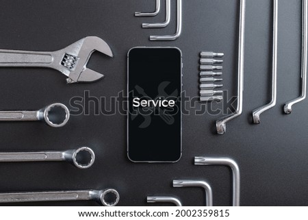 Phone service. Technician workplace with phone and special repairing tools. Cellphone technology device maintenance engineer