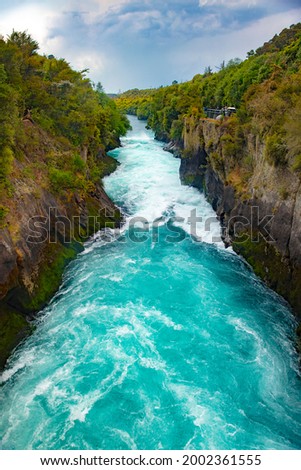 Wild stream of Huka Falls near Lake Taupo, New Zealand Royalty-Free Stock Photo #2002361555