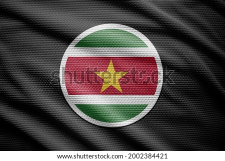 Suriname flag isolated on black background. National symbols of Suriname.