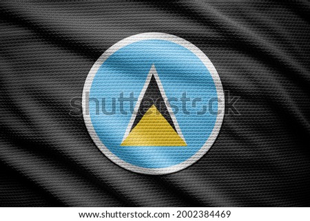 Saint Lucia flag isolated on black background. National symbols of Saint Lucia.