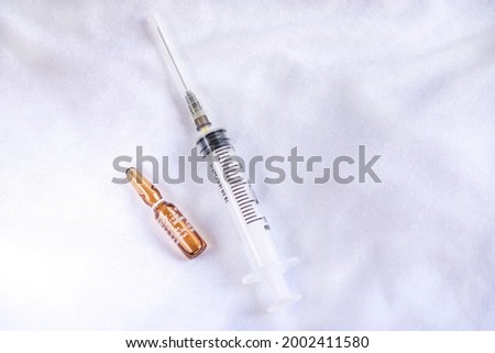 D vitamin flacon and syringe on isolated background, close up