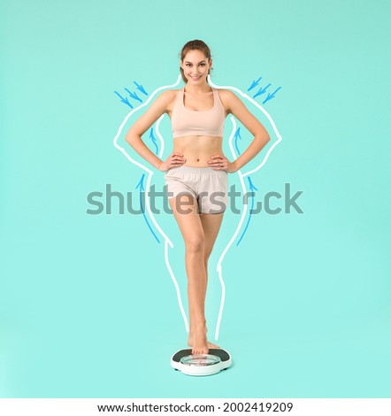 Beautiful young woman with measuring scales after weight loss on color background Royalty-Free Stock Photo #2002419209
