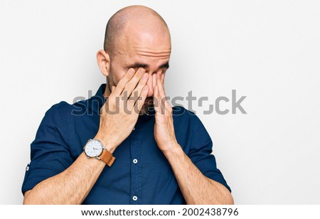 Young hispanic man wearing casual clothes rubbing eyes for fatigue and headache, sleepy and tired expression. vision problem 